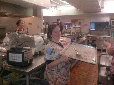 Cooks and staff working in the nursing home kitchen